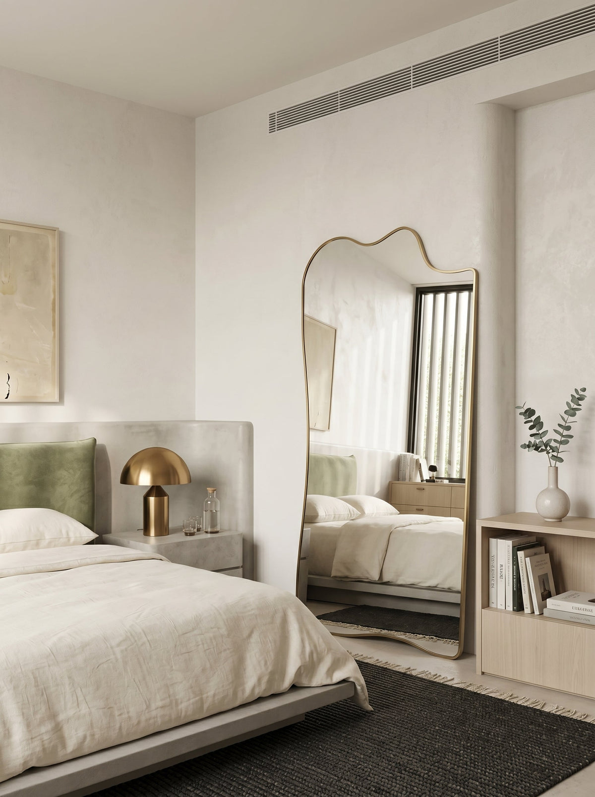 Champagne gold asymmetrical full-length leaner mirror in a minimalist bedroom