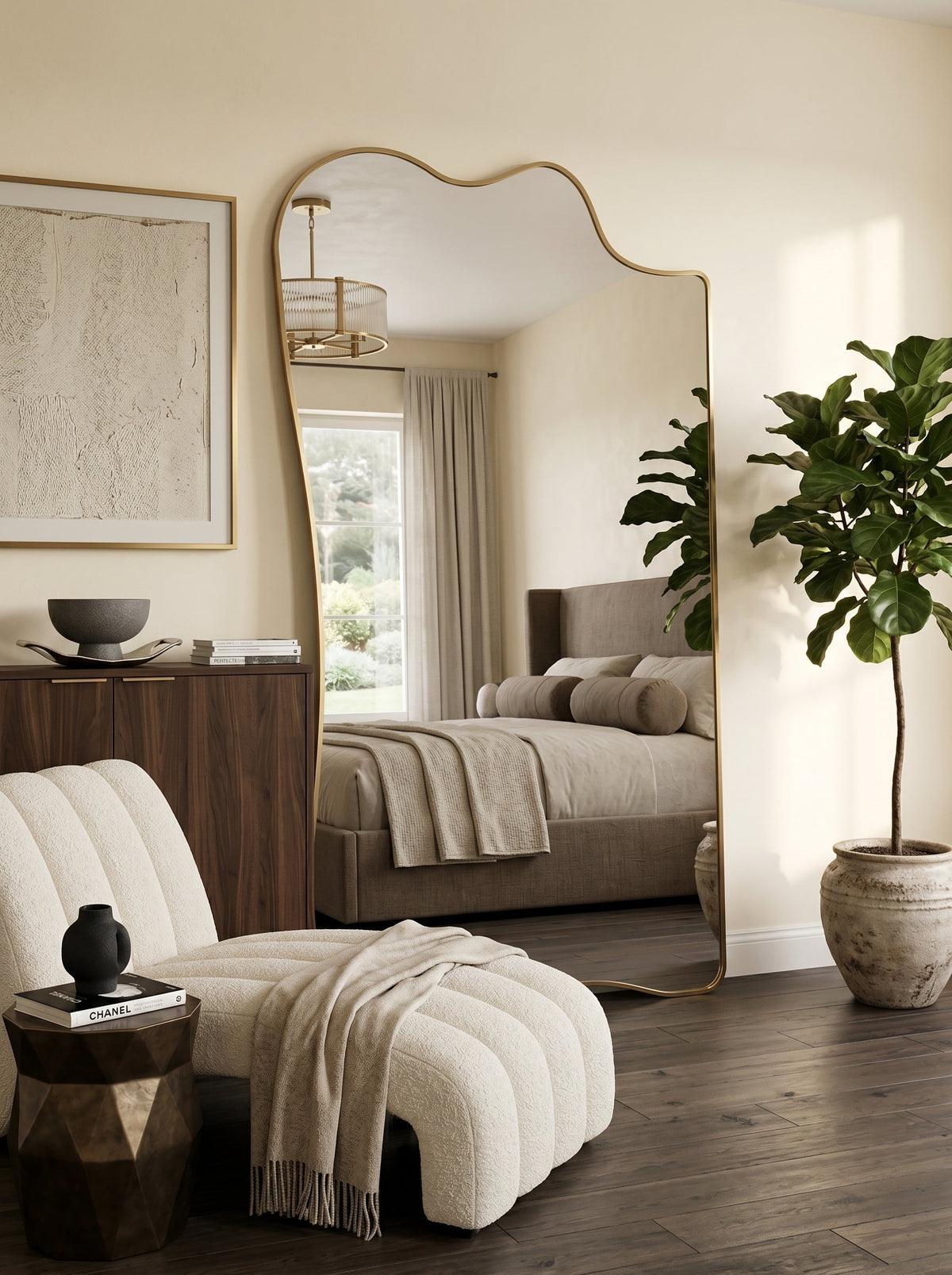 Champagne gold full-length asymmetrical leaner mirror in a neutral bedroom with a fiddle-leaf fig